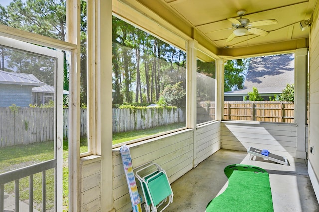 sunroom / solarium with plenty of natural light and ceiling fan