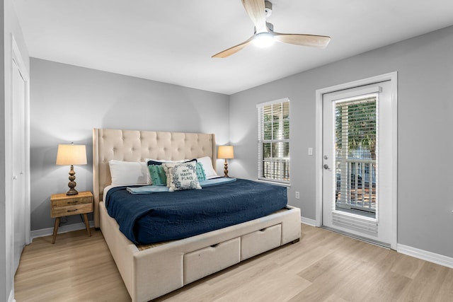 bedroom with access to outside, light hardwood / wood-style flooring, and ceiling fan