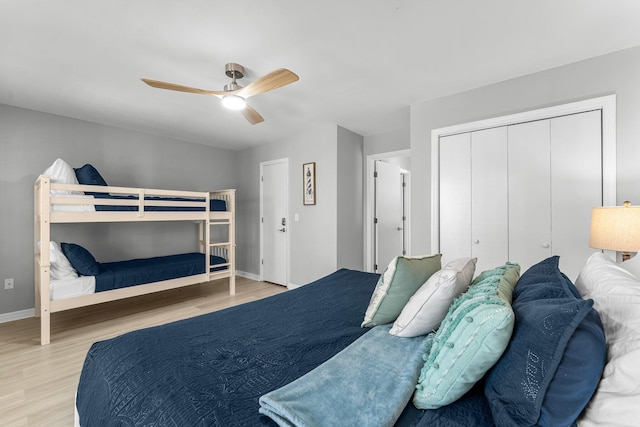 bedroom featuring a closet, ceiling fan, and light hardwood / wood-style flooring