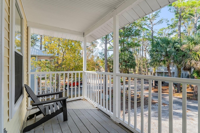 wooden terrace featuring a porch