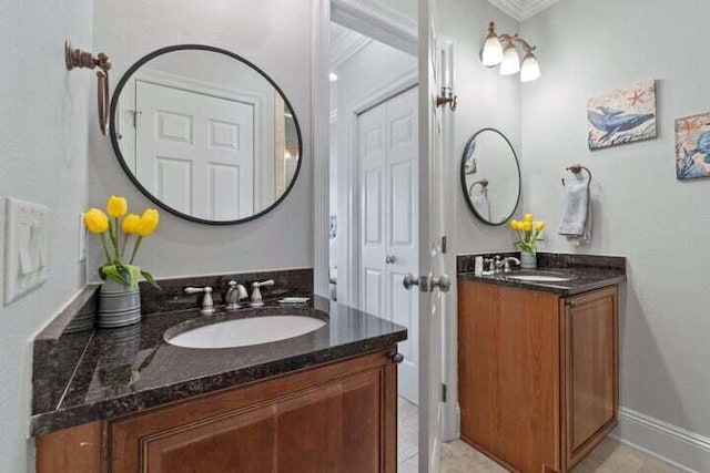 bathroom featuring vanity and ornamental molding