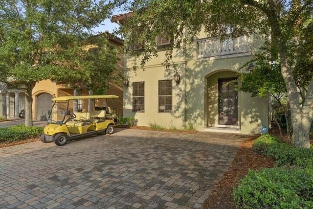 mediterranean / spanish-style home featuring a garage