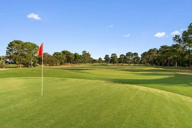 1900 Baytowne Loop, Miramar Beach, FL 32550 - view of community with golf course view, a putting area, view of wooded area, and a yard