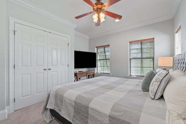 bedroom with light colored carpet, multiple windows, and ornamental molding