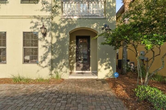 1900 Baytowne Loop, Miramar Beach, FL 32550 - view of exterior entry with stucco siding and a balcony
