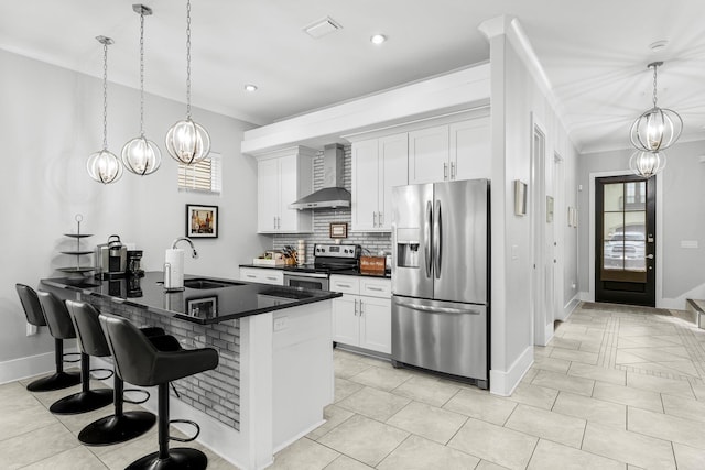 kitchen featuring white cabinetry, sink, wall chimney exhaust hood, and stainless steel appliances