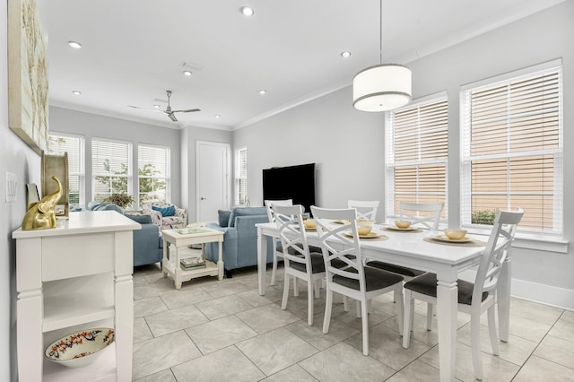 dining area with ceiling fan, ornamental molding, and light tile patterned floors