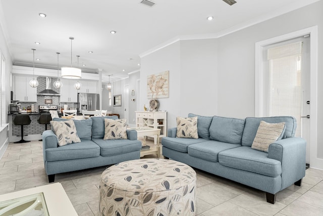 tiled living room with ornamental molding