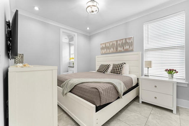 bedroom featuring ornamental molding and light tile patterned flooring