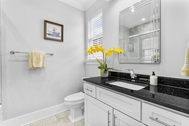 bathroom with walk in shower, tile patterned floors, crown molding, toilet, and vanity