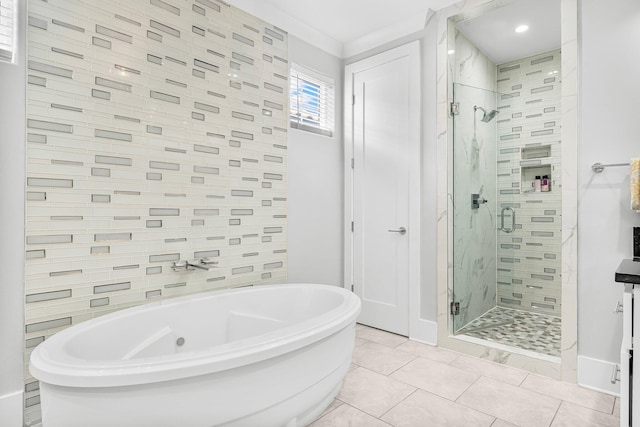 bathroom featuring tile patterned floors and independent shower and bath