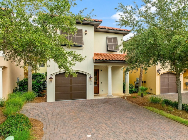 mediterranean / spanish-style house featuring a garage