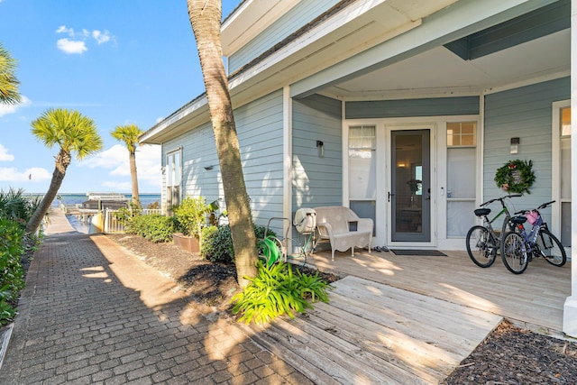 wooden deck featuring a water view