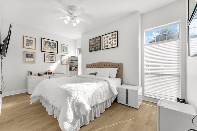 bedroom featuring light hardwood / wood-style floors and ceiling fan