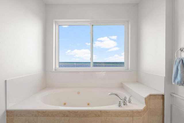 bathroom featuring tiled bath