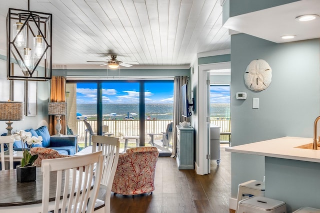 dining room with wood ceiling, ceiling fan, and dark wood-type flooring