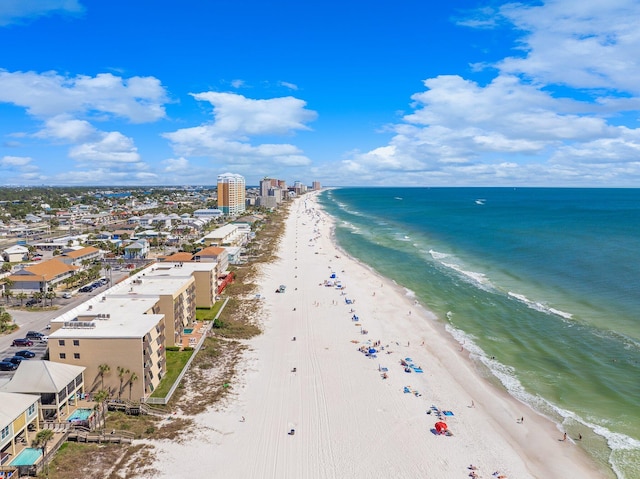 bird's eye view with a water view and a beach view