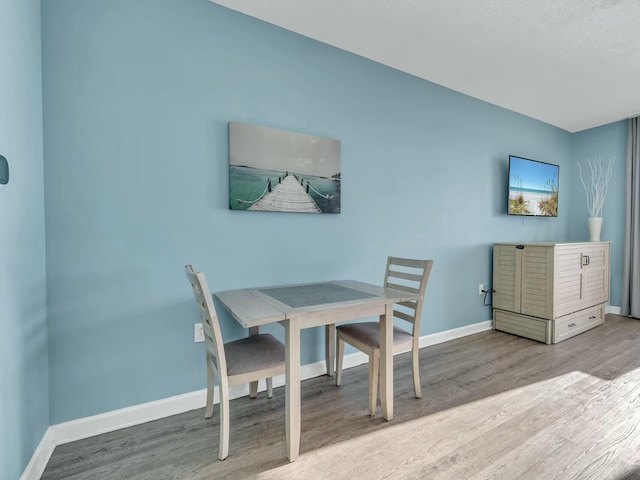 dining space featuring hardwood / wood-style flooring