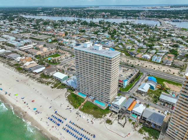 aerial view with a water view and a view of the beach