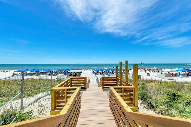 view of property's community with a view of the beach and a water view