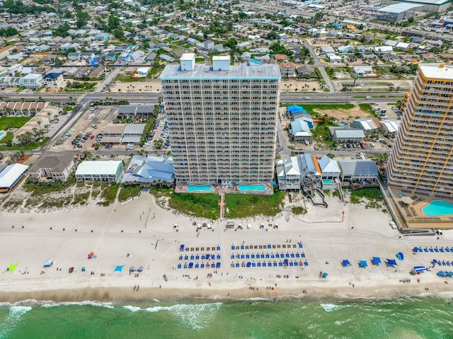 bird's eye view with a water view and a view of the beach