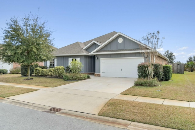 view of front of property with a front lawn and a garage