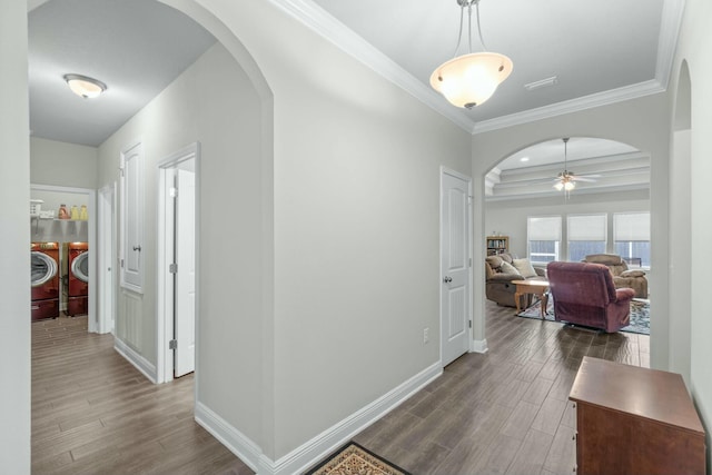 corridor with washing machine and clothes dryer and ornamental molding