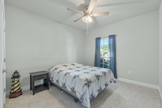 bedroom with light colored carpet and ceiling fan