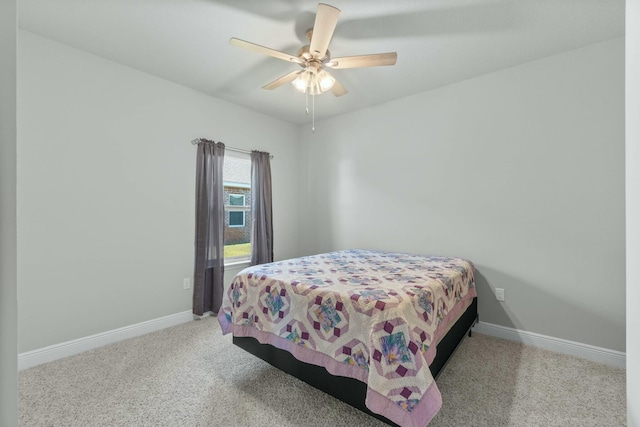 bedroom with ceiling fan and light carpet