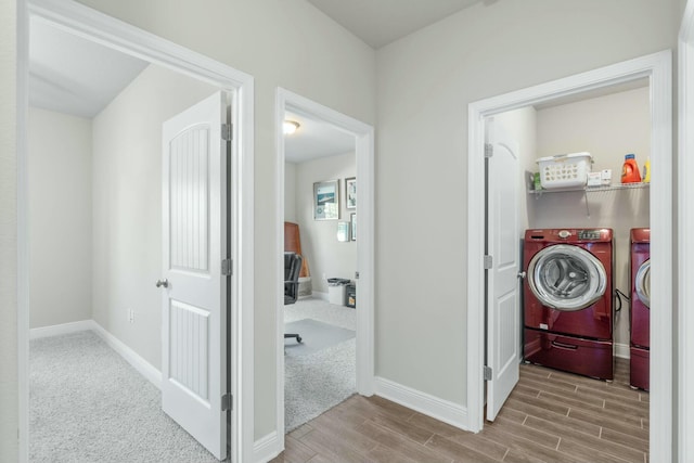 corridor featuring washer and dryer