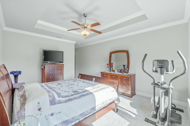 bedroom with a raised ceiling, ceiling fan, and ornamental molding