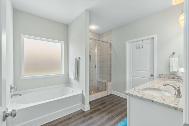 bathroom with separate shower and tub and vanity