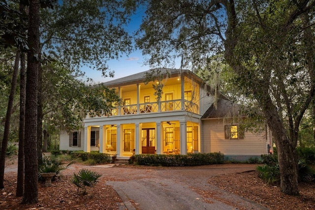 exterior space with a balcony and covered porch