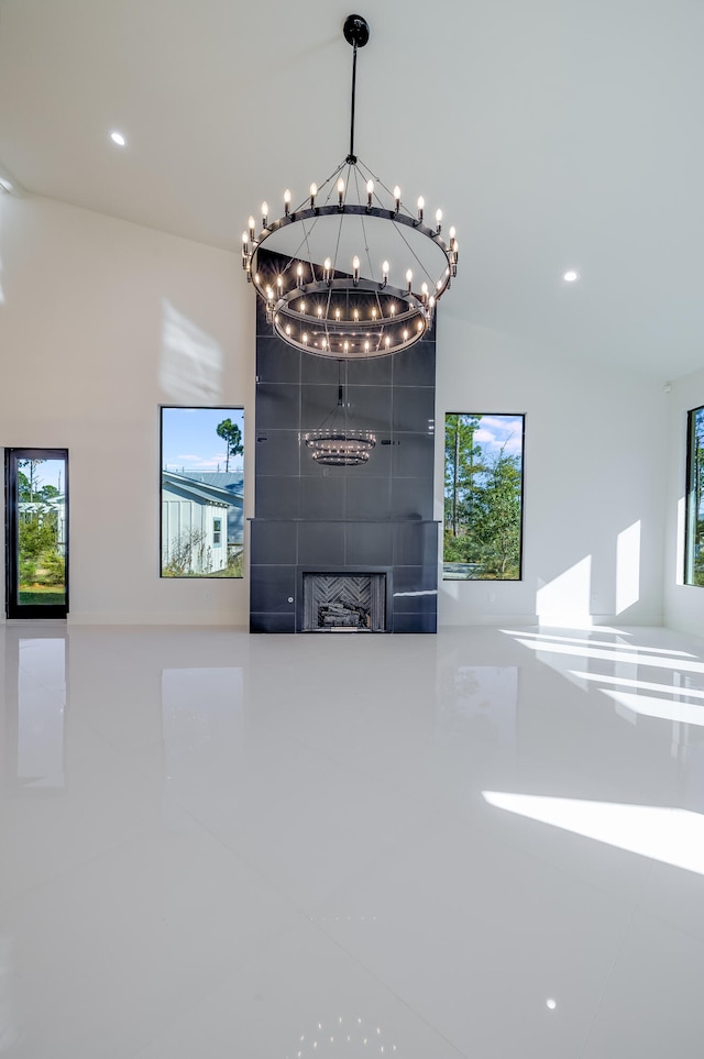 interior space with a fireplace and a chandelier