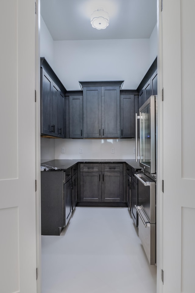 kitchen featuring dark brown cabinets