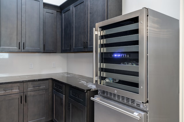 kitchen featuring oven and dark stone counters