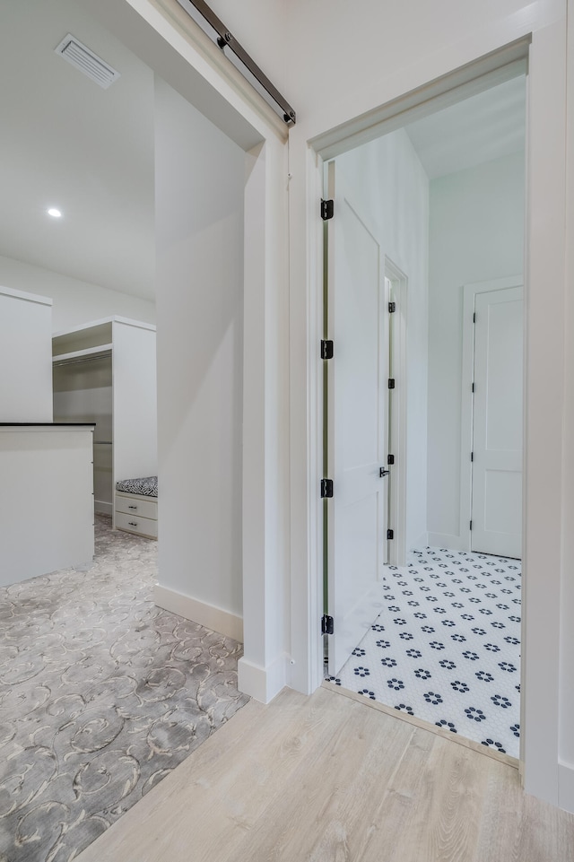 hall featuring light hardwood / wood-style floors