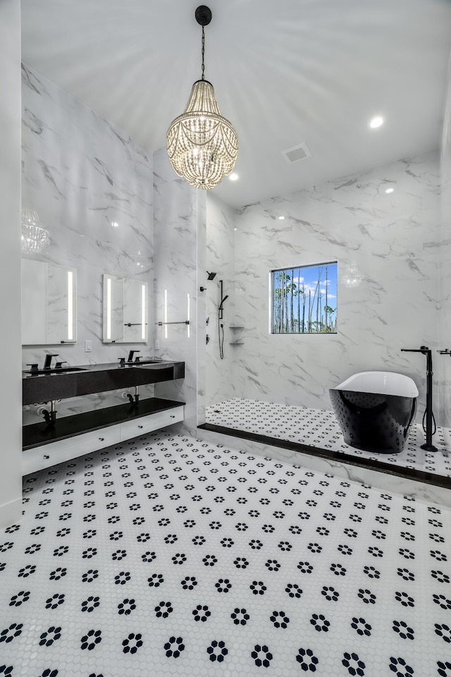 bathroom featuring vanity, tile walls, shower with separate bathtub, and an inviting chandelier