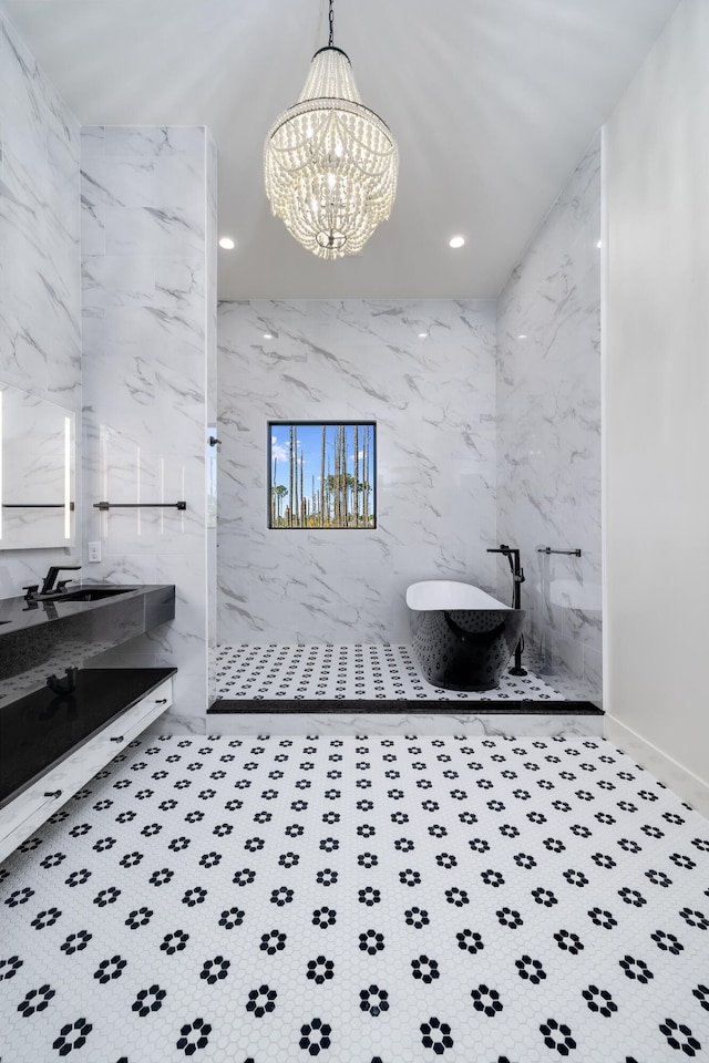 bathroom featuring a chandelier and independent shower and bath