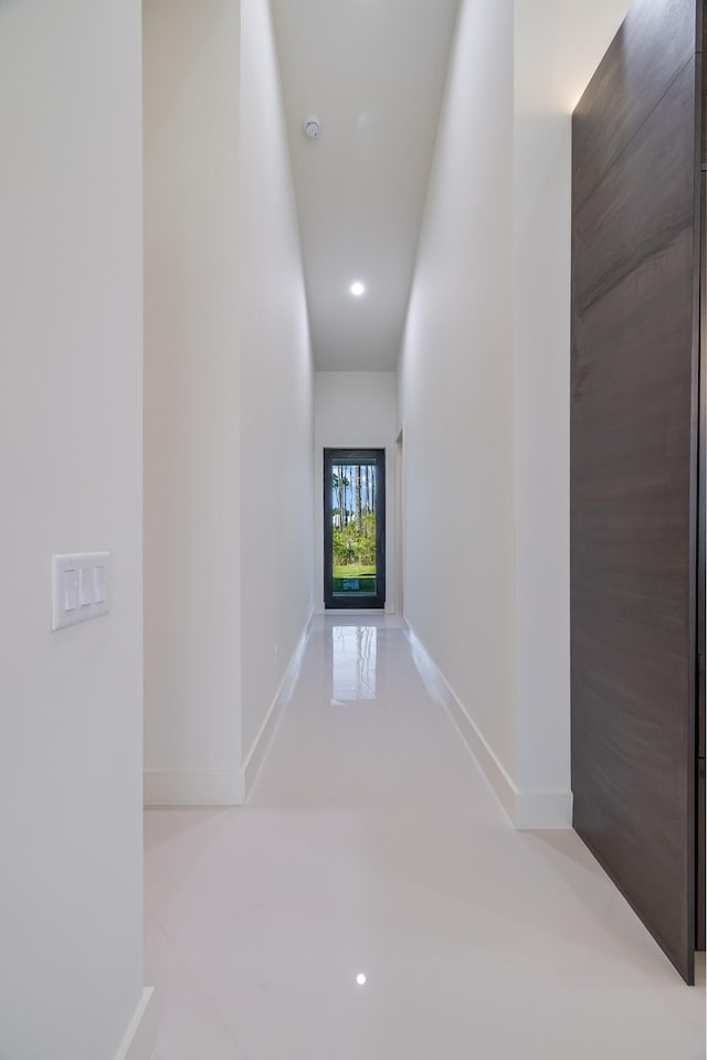 hall featuring light tile patterned floors