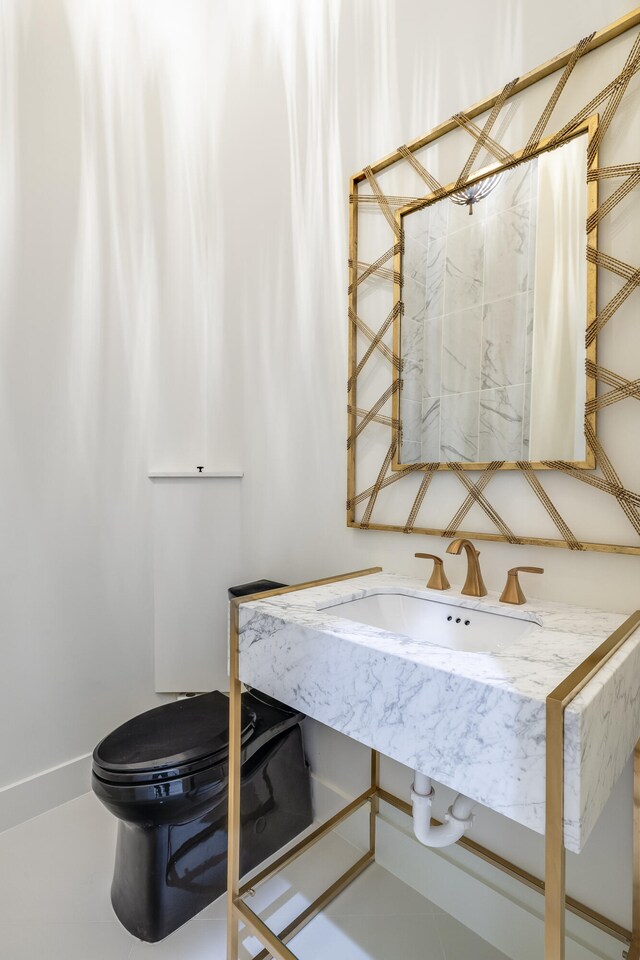 bathroom with toilet and sink