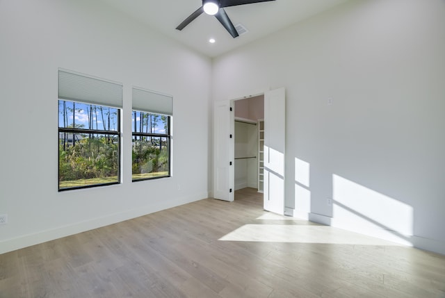 spare room featuring ceiling fan and light hardwood / wood-style flooring