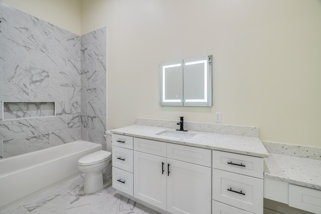 full bathroom featuring vanity, tiled shower / bath combo, and toilet