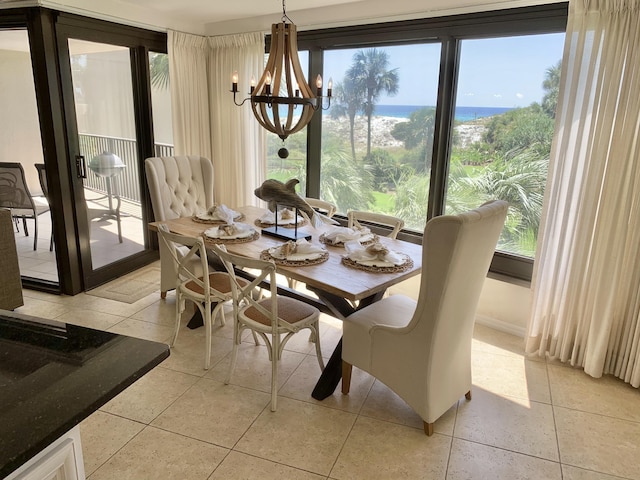 dining area featuring a chandelier and light tile patterned floors