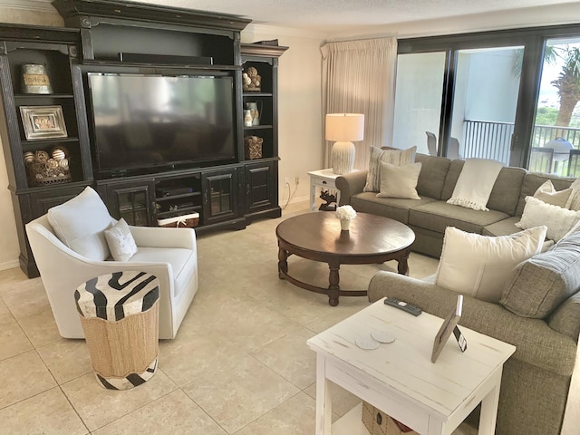 living room with light tile patterned floors and ornamental molding