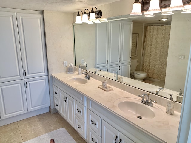 bathroom featuring tile patterned flooring, a textured ceiling, toilet, vanity, and a shower with shower curtain