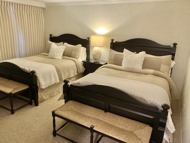 bedroom with carpet floors and ornamental molding