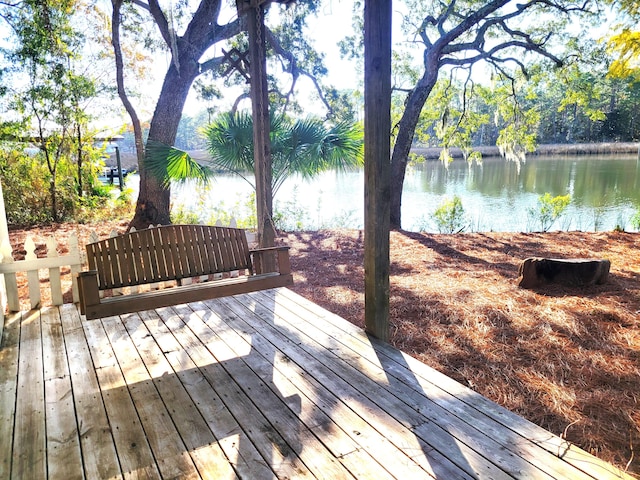 wooden terrace with a water view