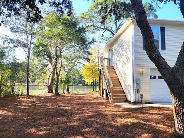 view of side of property with a garage