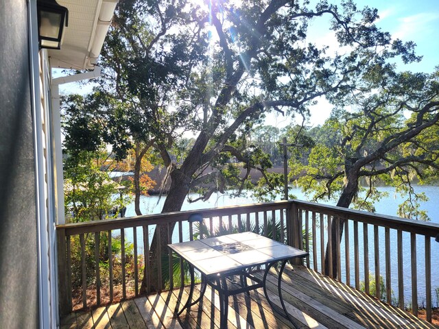 wooden deck featuring a water view